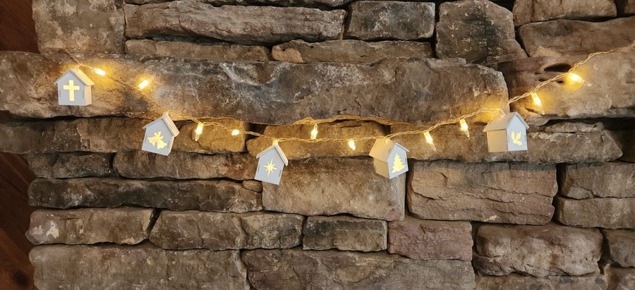 A warm wood piece glowing by the fireplace